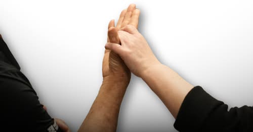Two hands, tactile signing.