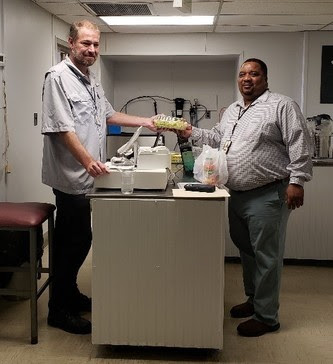Steve and Clayton Coe from the MD Office of General Services, at the counter in the Eutaw Cafe.