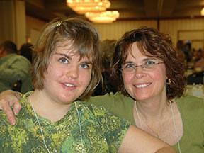a mother and daughter pose at a transition fair.