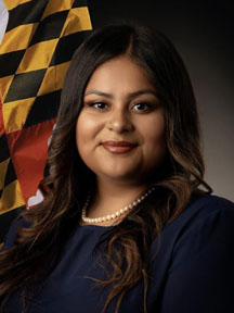Jhoselin's headshot, with a Maryland flag in the background.