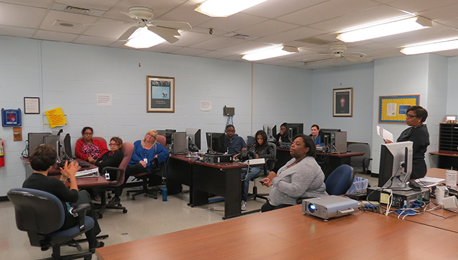 A Travel Training classroom session with six students, two instructors, and an ASL interpreter.