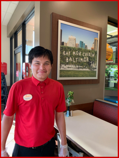Dustin smiling, standing in the Chick-fil-A restaurant